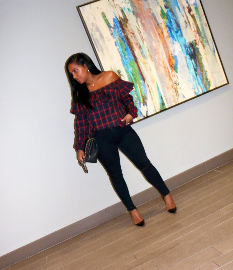 off the shoulder ruffled top and black jeans fashion blogger